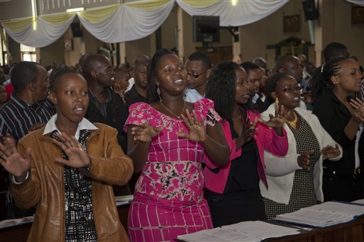 Kenyan Christians sing during a morning service at Holy Family Basilica, Nairobi, Kenya, Sunday, April 5, 2015, during Easter Sunday when Christians celebrate the resurrection of their Lord, Jesus Christ, according to Scripture after his crucifixion on the cross. Special prayers were held Sunday for the victims of the recent Garissa University Attack, when Al-Shabab gunmen rampaged through the university in northeastern Kenya on Thursday, killing scores of people.  AP