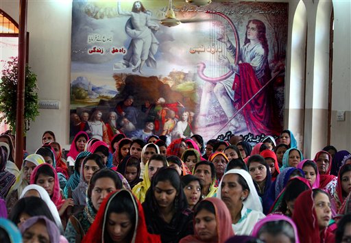Christians pray during Easter service at St. Oswald's Church in Lahore, Pakistan, Sunday, April 5, 2015. Christians across the world are celebrating Easter, commemorating the day followers believe Jesus was resurrected in Jerusalem over 2,000 years ago. AP