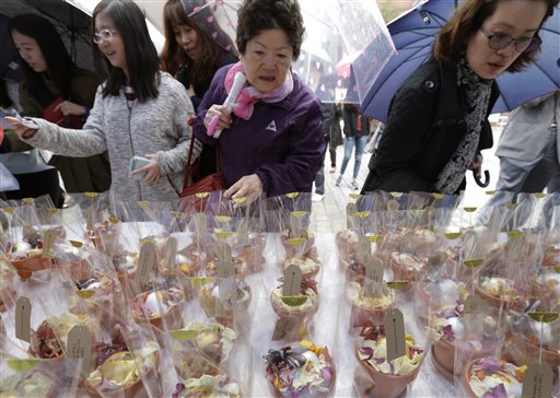 South Korean Catholics buy eggs to celebrate Easter at Myungdong Cathedral in Seoul, South Korea, Sunday, April 5, 2015. AP