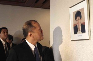 TWO AQUINOS On the last day of his state visit to Japan, President Aquino casts a meaningful look at the picture of his late mother, former President Corazon Aquino, in the guest room of the Nippon Press Center in Tokyo. Ms Aquino’s photo was taken in 1986. MALACAÑANG PHOTO BUREAU