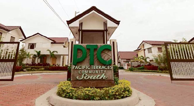 GATE TO THE GOOD LIFE A simple gate at the Pacific Terraces in the ACM Homes’ seafarers’ community welcomes sailors to the good life, which includes lots of open space, parks, a greenhouse and library.Withmost home buyers deployed overseas, the company said they’re building a secure environment that’s also family-centered in Cavite and Batangas. CONTRIBUTED PHOTO