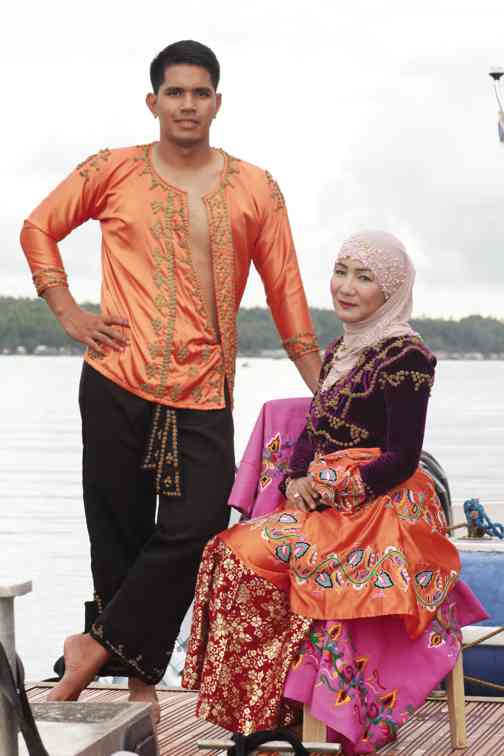 TAWI-TAWI Rep. Ruby M. Sahali and Jomar Ermino of PNP Maritime Group gamely pose in Tausug attire.