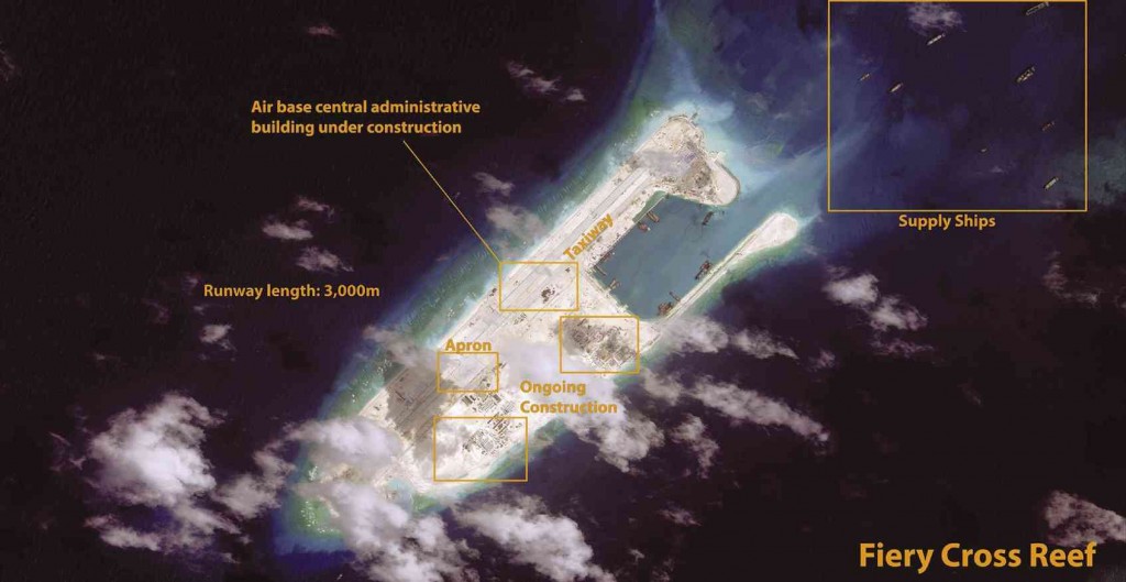 KAGITINGAN REEF  China is expanding construction on Fiery Cross Reef, also known as Kagitingan Reef, as seen in this June 28 satellite image. A 3,000-meter airstrip is nearly complete. China continues to pave and mark the airstrip and an apron and taxiway have been added adjacent to the runway. Personnel are now visible walking around the island. A sensor array has also been constructed and additional support facilities are being built. CSIS ASIA MARITIME TRANSPARENCY INITIATIVE/DIGITAL GLOBE