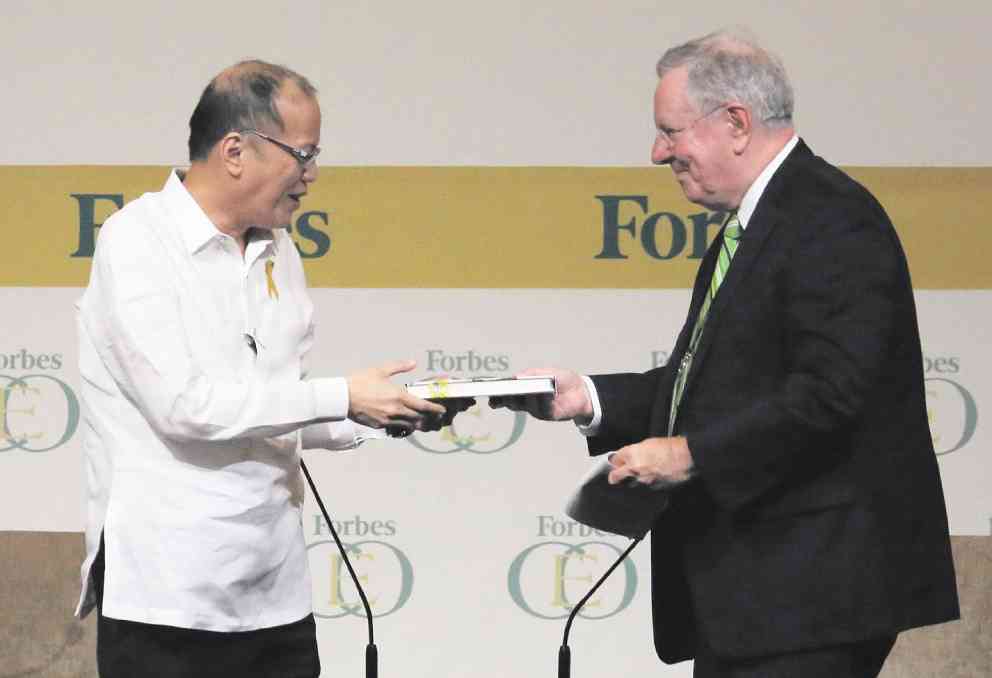 GOOD READ Steve Forbes, chair and editor in chief of Forbes Media, presents President Aquino with a copy of a book he has written after the Forbes Global CEO Conference on Wednesday. RAFFY LERMA