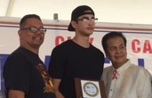 FILIPINO basketball player Kobe Paras receives an award from Carson Mayor Pro Tem Elito Santarina, while Johnny Itliong (left), son of the late Fil-Am labor leader Larry Itliong, looks on. NIMFA RUEDA