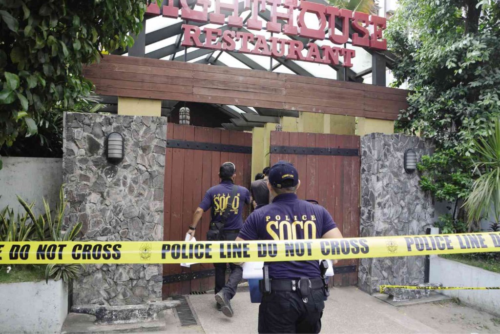SHOOTING IN LIGHTHOUSE Police scene of crime investigators enter Lighthouse Restaurant on Gen. Maxilom Avenue in Cebu City following the shooting of two Chinese diplomats allegedly by a fellow Chinese consular officer over lunch Wednesday. CHRISTIAN MANINGO / CEBU DAILY NEWS