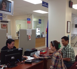 a Filipino couple registering to be voters at the  consulate