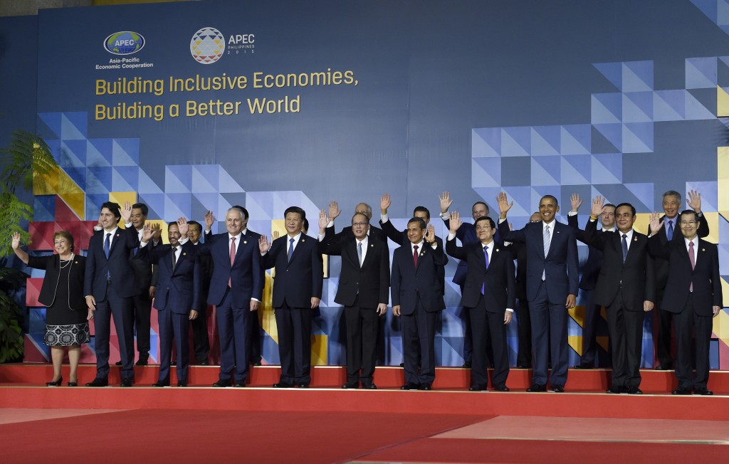 President Barack Obama, third right in front, poses for a family photo with other leaders at the Asia-Pacific Economic Cooperation summit in Manila, Philippines, Thursday, Nov. 19, 2015. Leaders in front row are, from left, Chiles President Michelle Bachelet, Canadian Prime Minister Justin Trudeau, Brunei's Sultan Hassanal Bolkiah, Australia's Prime Minister Malcolm Turnbull, Chinese President Xi Jinping, Philippines President Benigno Aquino III, Perus President Ollanta Humala Tasso, Vietnam's President Truong Tan Sang, Obama, Thai Prime Minister Prayuth Chan-ocha and Taiwan's envoy Vincent Siew. (AP Photo/Susan Walsh)
