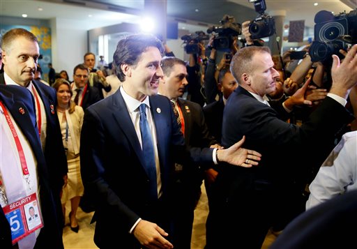 Canadian Prime Minister Justin Trudeau is mobbed by the media following a news conference with Canadian and Philippine media at the Asia-Pacific Economic Cooperation Summit of Leaders Thursday, Nov. 19, 2015 in Manila, Philippines. AP 
