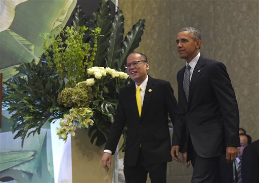 U.S. President Barack Obama, right, and Philippines' President Benigno Aquino III, left, arrive for a news conference in Manila, Philippines, Wednesday, Nov. 18, 2015, ahead of the start of the Asia-Pacific Economic Cooperation summit. (AP Photo/Susan Walsh)