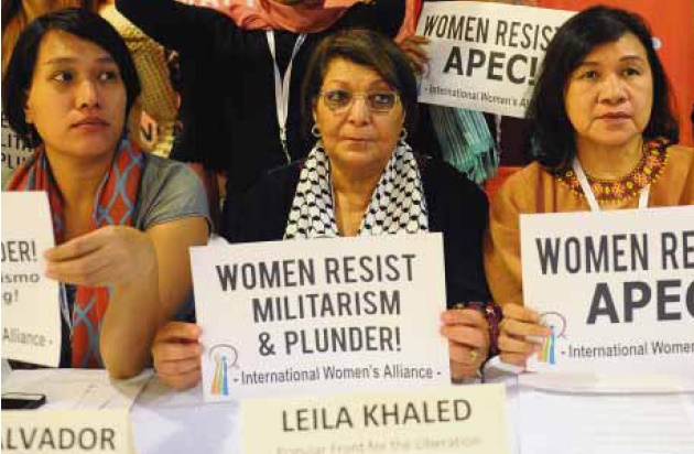 FREEDOM FIGHTER INTOWN Palestinian freedom fighter and two-time plane hijacker Leila Khaled (center) joins Gabriela party-list Rep. Liza Maza (right) and other women activists during the InternationalWomen’s Alliance General Assembly forum in Manila onWednesday. The forum was protesting the Philippines’ hosting of the Apec Leaders’ meeting next week. AFP