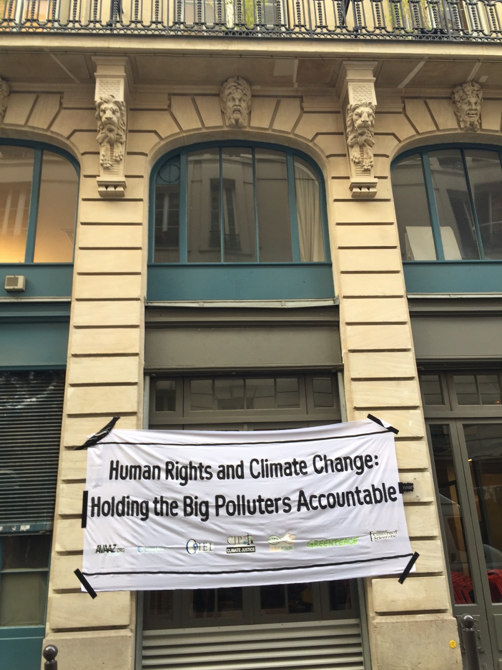 A large streamer outside the venue of the press briefing organized by Greenpeace International calls for corporate accountability. JN