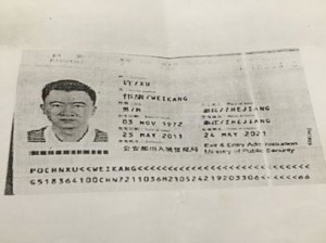 A photograph of Weikang Xu's passport.  Xu is being investigated for the cyber-heist of $81 million from the Bangladesh central bank and the laundering of the money in a Philippine bank, RCBC.  Photo by Nancy Carvajal, INQUIRER