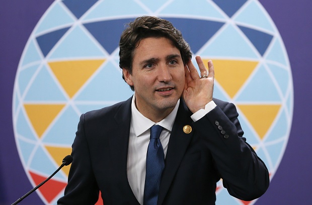 Canadian Prime Minister Justin Trudeau listens to a question during a news conference following the Asia-Pacific Economic Cooperation Summit of Leaders Thursday, Nov. 19, 2015 in Manila, Philippines. Prime Minister Trudeau is embarking on his first foreign trip since becoming a Prime Minister.(AP Photo/Bullit Marquez)