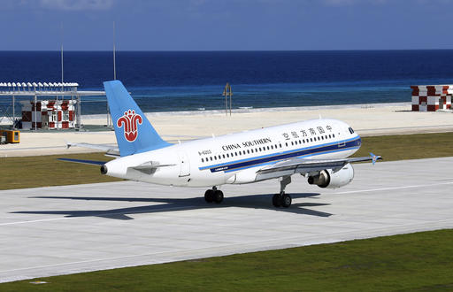 FILE - In this Jan. 6, 2016 photo released by China's Xinhua News Agency, a China Southern Airlines jetliner lands at the airfield on Fiery Cross Reef, known as Yongshu Reef in Chinese, in the Spratly Islands, known as Nansha Islands in Chinese, of the South China Sea.  Tensions in the South China Sea are rising, pitting China against smaller and weaker neighbors that all lay claim to islands, coral reefs and lagoons in waters rich in fish and potential gas and oil reserves. China’s recent construction of artificial islands in the Spratly archipelago, complete with airstrips and radar stations, and U.S. patrols challenging Beijing’s vast territorial claims, have caused concern that the strategically important waters could become a flashpoint.  (Cha Chunming/Xinhua via AP, File) NO SALES