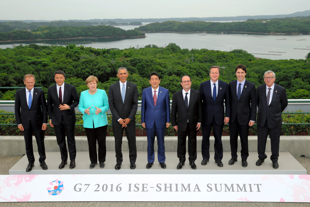 Japanese Prime Minister Shinzo Abe, center, stands with other leaders of Group of Seven industrial nations, from left, European Council President Donald Tusk, Italian Prime Minister Matteo Renzi, German Chancellor Angela Merkel, U.S. President Barack Obama, Abe, French President Francois Hollande, British Prime Minister David Cameron, Canadian Prime Minister Justin Trudeau and European Commission President Jean-Claude Juncker as they pose for the family photo during the first day of the G-7 summit meetings in Shima, Japan, Thursday, May 26, 2016. (Japan Pool via AP) 