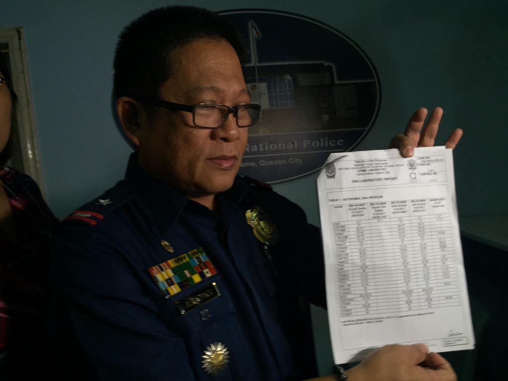 PNP Crime Laboratory director Chief Supt. Emmanuel Aranas shows the result of the DNA test conducted to confirm whether the severed head found in Sulu belonged to Canadian Abu Sayyaf captive Robert Hall. JULLIANE LOVE DE JESUS/INQUIRER.net