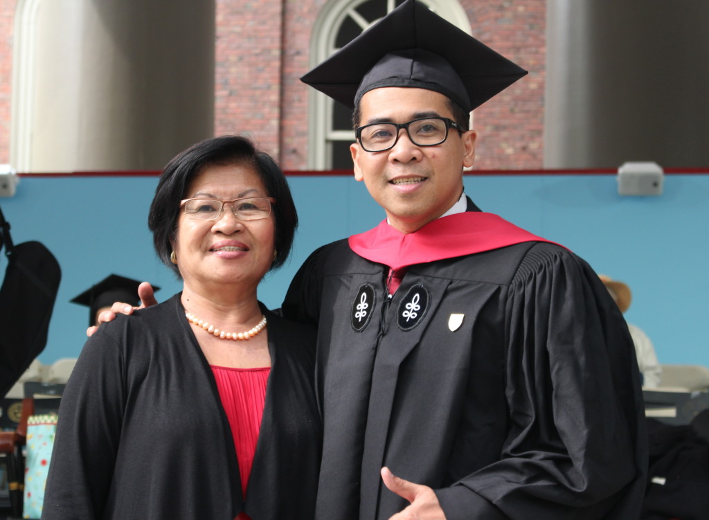 Michael Ubac poses with his proud mother, Arlina, at the 365th Commencement of Harvard University on May 26, 2016 at the university's Tercentenary Theatre, where some 7,727 students—both undergraduate and graduate students--were conferred degrees during the morning exercise witnessed by an audience of 32,000.