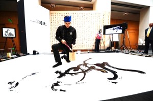 Kristian Kabuay demonstrating his skills in calligraphy at the Asian Art Museum last March