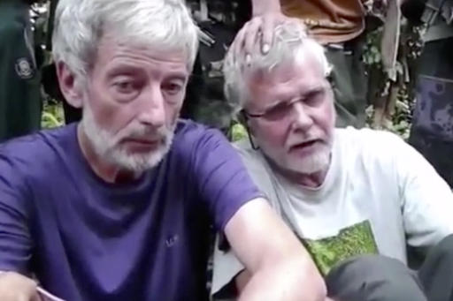This file image made from undated militant video, shows Canadians Robert Hall, left, and John Ridsdel, right. Police found a severed head in the southern Philippines on Monday, June 13, 2016, and are examining whether it belonged to Canadian hostage Robert Hall, who is believed to have been beheaded by Abu Sayyaf militants after a ransom deadline passed, officials said. Ridsdel was beheaded in April. Militant Video via AP Video, File