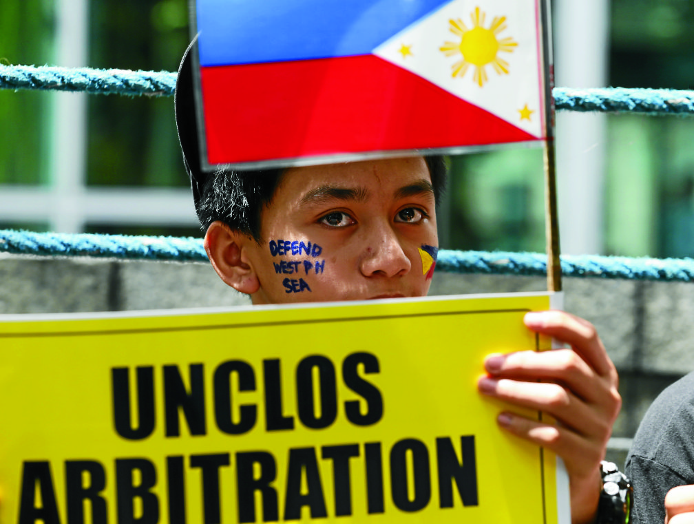 ANTI-CHINA A protester stands outside the Chinese Consulate in Manila during a rally against China’s occupation and island-building in the Spratly island group in the South China Sea in this file photo. AP