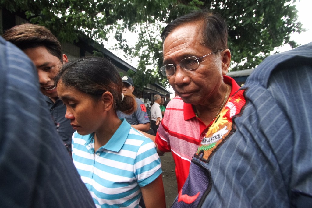 MARITESS FLOR / JUNE 24, 2016 Incoming Presidential Adviser to the Peace Process Jesus Dureza escorts Maritess Flor in Davao City after her safe release from the Abu Sayyaf was facilitated by the team of incoming President Rodrigo Duterte.  PHOTO BY KARLOS MANLUPIG