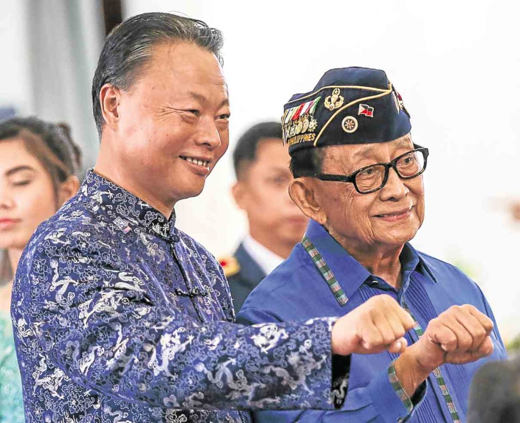 FRENEMIES? Former President and special envoy to China Fidel V. Ramos (right) and Chinese Ambassador Zhao Jianhua pose for a souvenir shot at Camp Crame in Quezon City. LYN RILLON