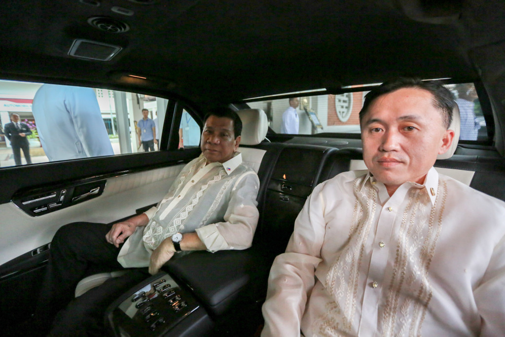 President Rodrigo Duterte is inside an official state car with Special Assistant to the President Christopher Lawrence Go following a meeting at the State Palace in Hanoi, Vietnam on September 29. KING RODRIGUEZ/ Presidential Photo
