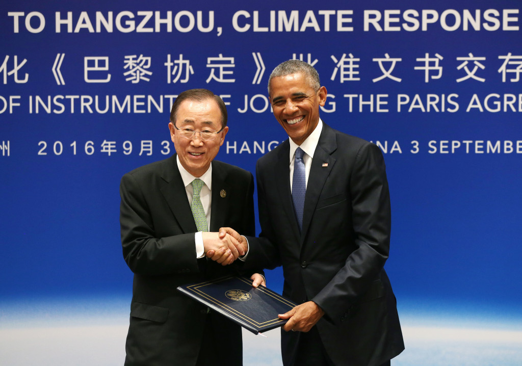 U.S. President Barack Obama, right, and U.N. Secretary-General Ban Ki-moon pose for photographers as they shake hands during a joint ratification of the Paris climate change agreement at the West Lake State Guest House in Hangzhou in eastern China's Zhejiang province, Saturday, Sept. 3, 2016. (How Hwee Young/Pool Photo via AP)