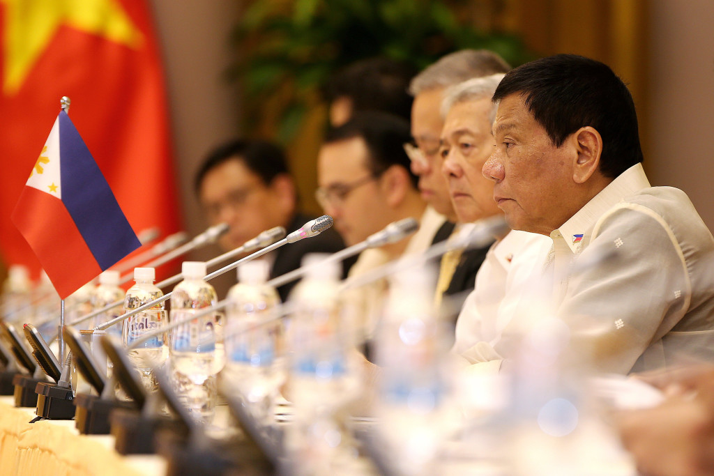 Philippines President Rodrigo Duterte, right, listens to his Vietnam's counterpart Tran Dai Quang during a meeting at the Presidential Palace in Hanoi, Vietnam, Thursday, Sept. 29, 2016. (Luong Thai Linh/Pool Photo via AP)