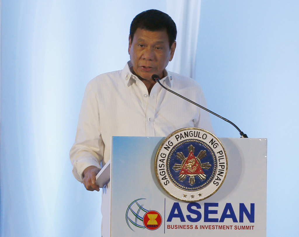 Philippine President Rodrigo Duterte addresses delegates of the ASEAN Business and Investment Summit, a parallel summit in the ongoing 28th and 29th ASEAN Summits and other related summits Tuesday, Sept. 6, 2016 in Vientiane, Laos. (AP Photo/Bullit Marquez)