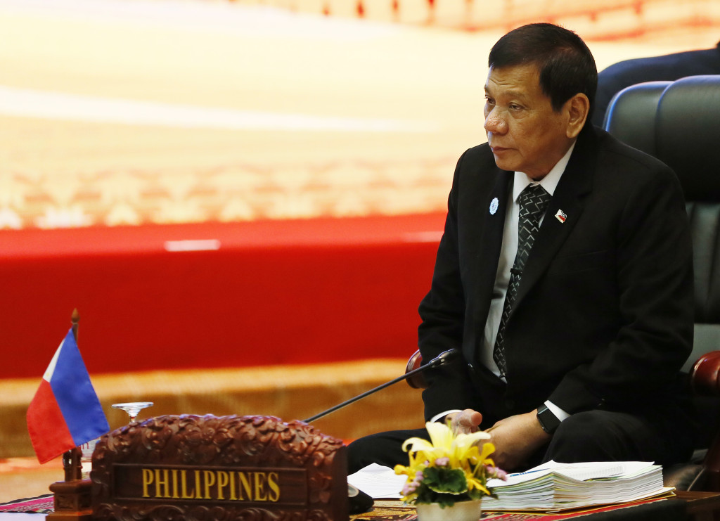 Philippines' President Rodrigo Duterte sits for the retreat session in the ongoing 28th and 29th ASEAN Summits at the National Convention Center, Wednesday, Sept. 7, 2016 in Vientiane, Laos. (AP Photo/Bullit Marquez)