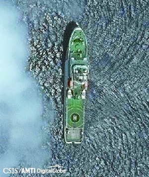 CHINESE PRESENCE A Chinese Coast Guard ship is seen near the disputed Scarborough Shoal in this aerial photo provided by the AsiaMaritime Transparency Initiative.