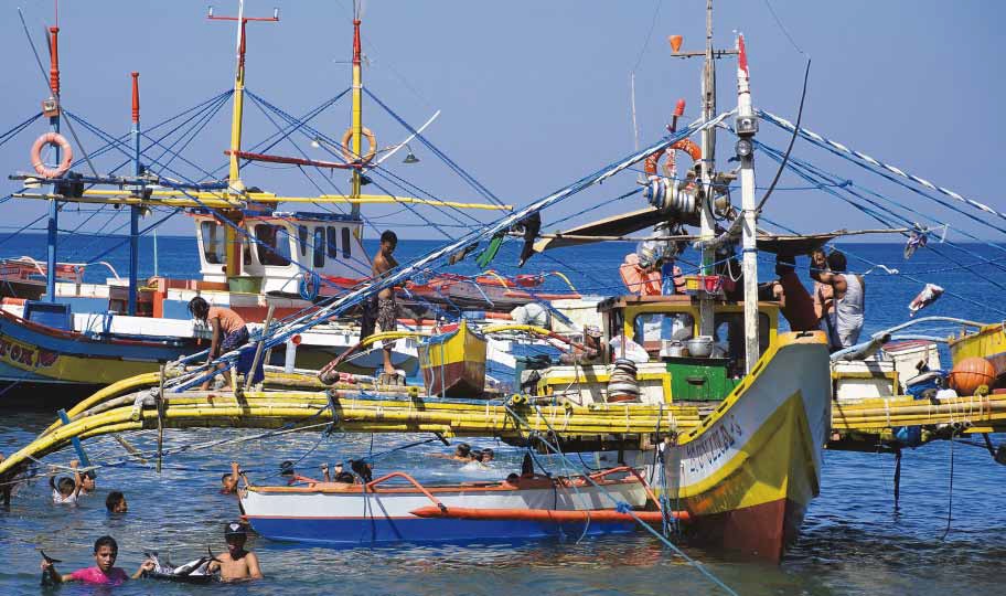 BETTER TIMES Filipino fishermen are optimistic they will be able to continue fishing at Panatag Shoal, but a maritime law and security expert cannot say how long will it last. —WILLIE LOMIBAO
