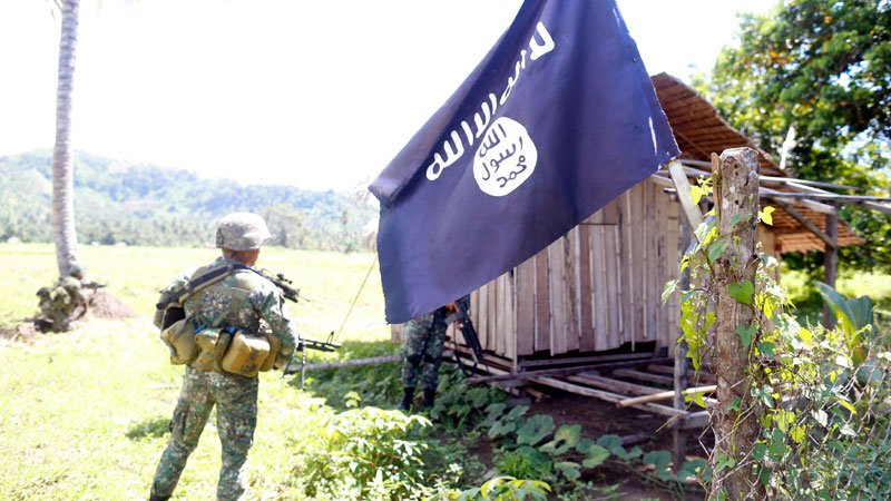 In this March 7, 2016 file photo, soldiers from the Philippine Marines capture a camp believed held by the local terror ISIS-inspired clan, the Maute Group, in Lanao del Sur (FILE PHOTO BY JEOFFREY MAITEM / INQUIRER MINDANAO) 