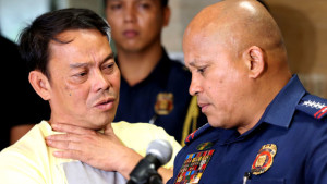 This photo taken on August 2, 2016, shows Leyte Albuera Mayor Ronaldo Espinosa (L) talking to Philippine National Police (PNP) chief Ronald dela Rosa (R) at Camp Crame in Manila.  Espinosa, linked to the illegal drug trade, was shot dead in cell on November 5, police said, the second local official implicated in narcotics to be killed in two weeks. / AFP / STRINGER        (Photo credit should read STRINGER/AFP/Getty Images)
