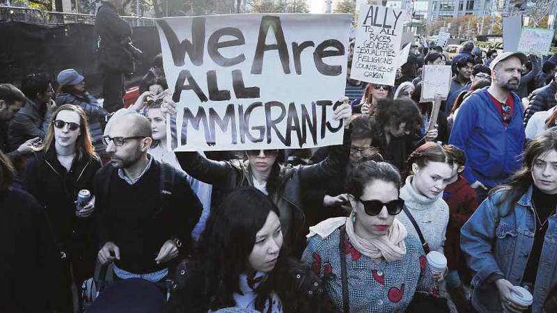 NEWYORK PROTEST Thousands of people, many of them supportive of immigrants, protest the election of Donald Trump outside one of his properties in New York. —AFP