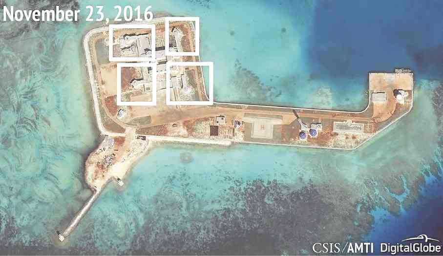 BATTLE-READY  A satellite image released on Dec. 13 shows what CSIS Asia Maritime Transparency Initiative says appears to be antiaircraft guns and what are likely to be close-in weapons systems on Hughes (McKennan) Reef in the  West Philippine Sea, part of the South China Sea. China has said it has no intention to militarize Hughes and six other artificial islands in the strategic waterway, where several countries have conflicting territorial claims. 