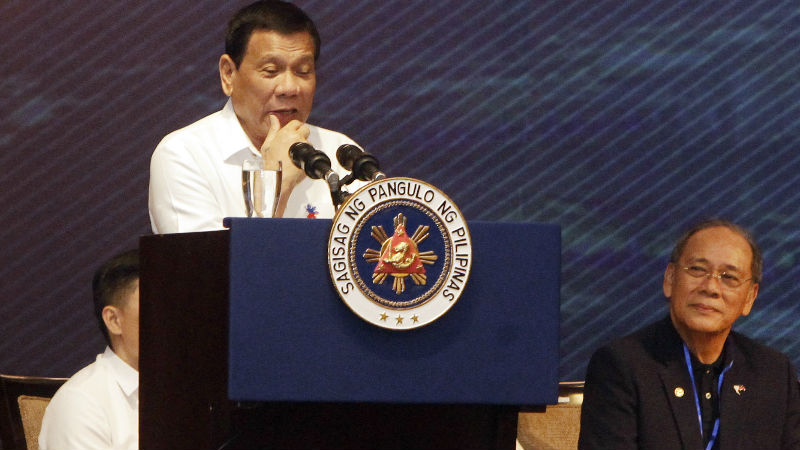 Philippine President Rodrigo Duterte, right, delivers a speech during a meeting with the Filipino community, in Phnom Penh, Cambodia, Tuesday, Dec. 13, 2016. Duterte on Tuesday arrived Phnom Penh on his two-day official to Cambodia. (AP Photo/Heng Sinith)