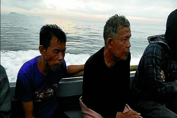 FINALLY, FREEDOM Malaysians Tayudin Anjut, 45, and Abdurahim Bin Sumas, 62, shown in this photo released by the Armed Forces’ Western Mindanao Command, were freed after eight months in captivity during a “focused military operation” in Sulu.