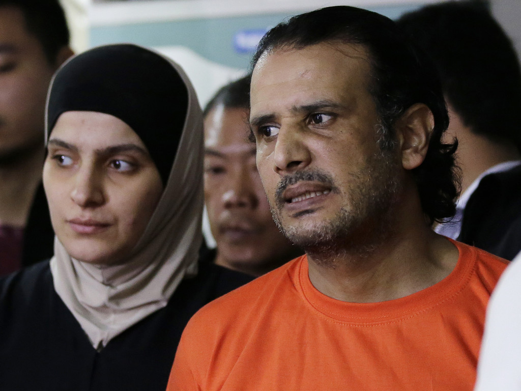 In this April 6, 2017 photo, suspected members of the Islamic State group, from left, Rahaf Zina Dhafiri and Hussein Aldhafiri are presented to reporters at the National Bureau of Investigation in Manila, Philippines. Philippine officials say U.S. and Kuwaiti security officials have helped them identify and arrest a Middle Eastern couple with suspected links to the Islamic State group and who may have the capability to launch bomb attacks. (AP Photo/Aaron Favila)