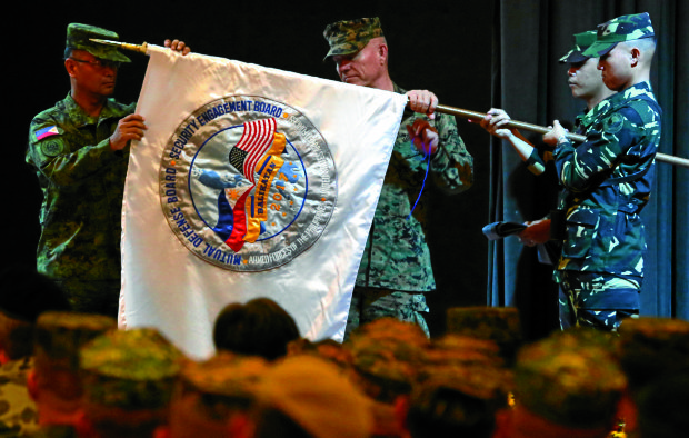 BALIKATAN OPENING / MAY 8, 2017 Balikatan 2017 co-directors Lt. Oscar Lactao of AFP and Lt. Gen. Lawrence D. Nicholson, US Marine Corps, unfurl the official flag to be used during the exercises during at the opening ceremony of the 2017 Balikatan military exercise held in Camp Aguinaldo in Quezon City, May 8, 2017.  INQUIRER PHOTO / NIÑO JESUS ORBETA