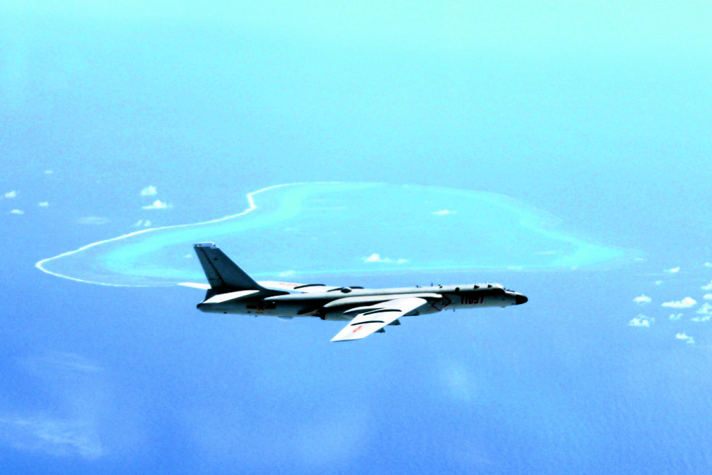 AIR SECURITY A Chinese bomber patrols the islands and reefs in the South China Sea in this undated photo released by Xinhua News Agency. —AP