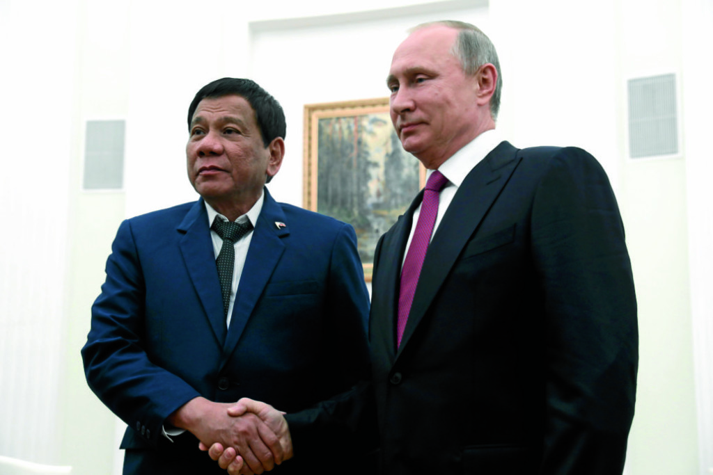 Russian President Vladimir Putin, right, shakes hands with Philippine President Rodrigo Duterte during their meeting at the Kremlin in Moscow, Tuesday, May 23, 2017. (Maxim Shemetov/Pool Photo via AP) 