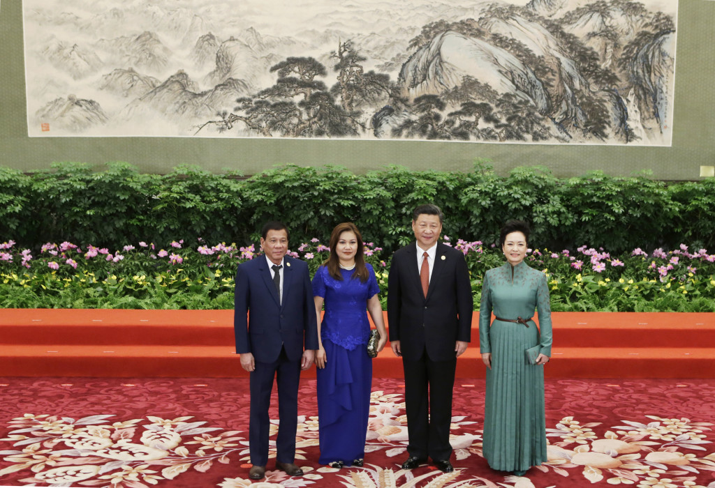 Chinese President Xi Jinping, second right, his wife Peng Liyuan, right, Philippine President Rodrigo Duterte and his partner Honeylet Avancena attend the welcoming banquet for the Belt and Road Forum, in Beijing, Sunday, May 14, 2017. (Jason Lee/Pool Photo via AP)