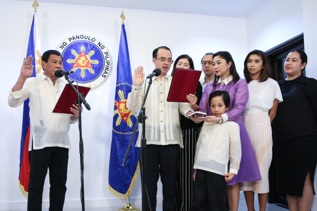 President Duterte administers the oath of office of Alan Peter Cayetano as the new Foreign Affairs Secretary at the Presidential Guesthouse in Panacan, Davao City.