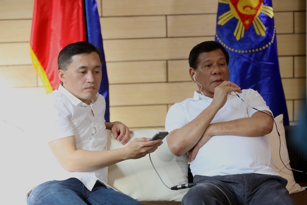 President Rodrigo Roa Duterte speaks with Peoples Republic of China President Xi Jinping through a phone call in Davao City on May 3, 2017. The Philippine President, among other things, thanked the Government of China for inviting him to tour the People’s Liberation Army Navy (PLAN) Flagship Destroyer ‘Chang Chun’ which was docked at the Sasa Port in Davao City early this week for a goodwill visit to the Philippines. With President Duterte is Special Assistant to the President Christopher 'Bong' Go. PRESIDENTIAL PHOTO