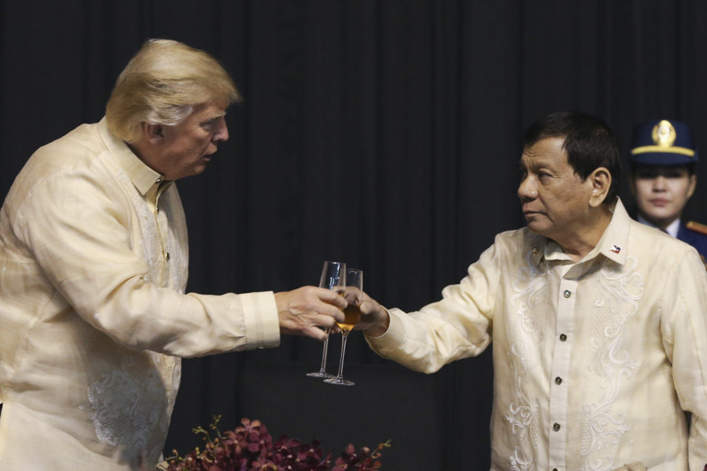U.S. President Donald Trump toasts with Philippines President Rodrigo Duterte during the gala dinner marking ASEAN's 50th anniversary in Manila, Philippines, Sunday, Nov. 12, 2017. (Athit Perawongmetha/Pool photo via AP)