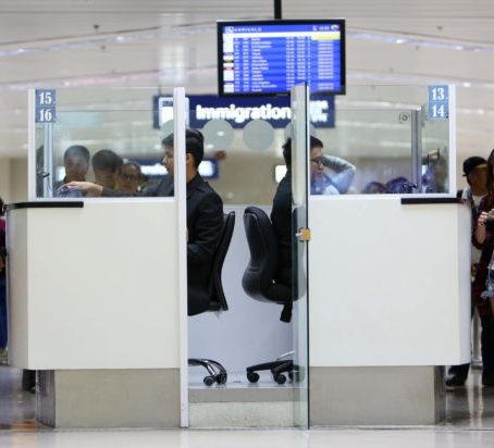 Immigration officers man their post at the Naia Terminal 1. INQUIRER FILE PHOTO / LYN RILLON