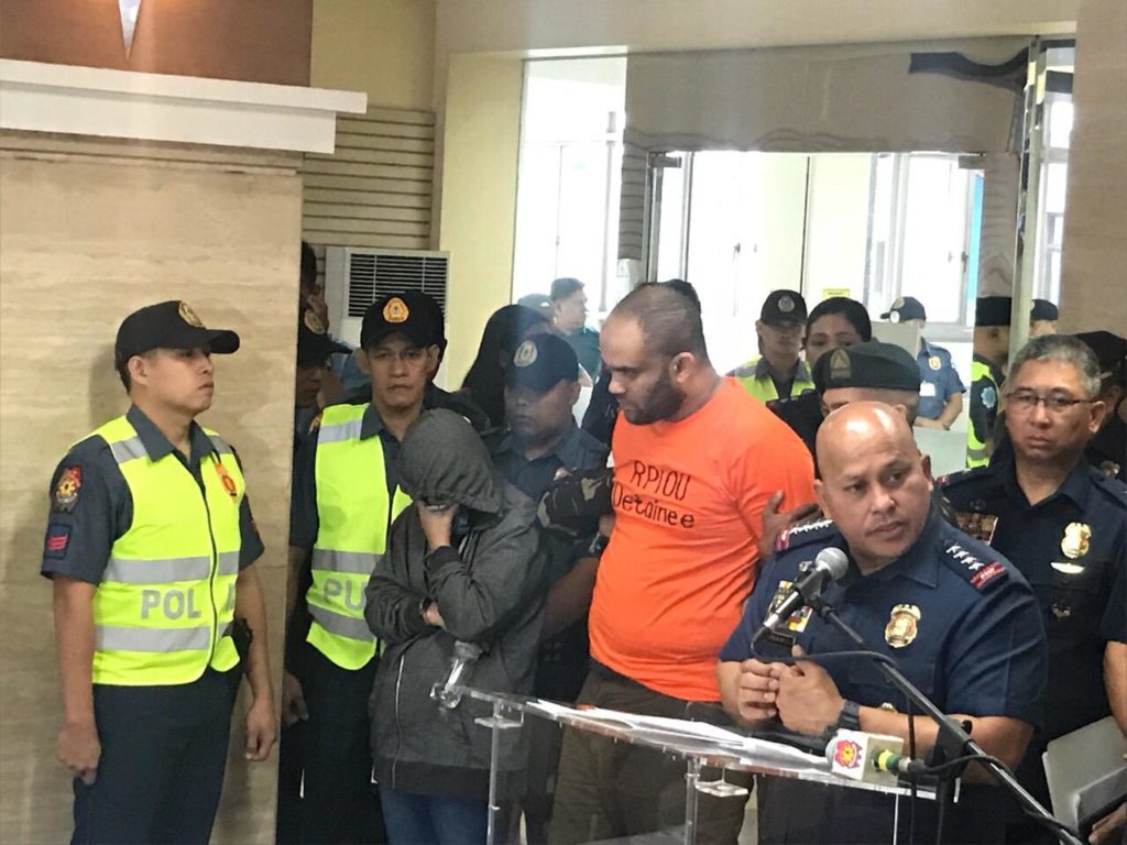 PNP chief Director General Ronald dela Rosa (right, foreground) presents to media Egyptian Fehmi Lassqued (in orange), an alleged leader of the terrorist group ISIS. CONTRIBUTED PHOTO